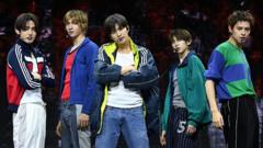 'Put your phone down': K-pop band weighs in on concert etiquette