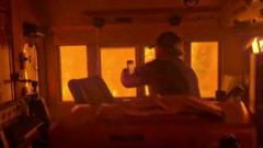 Canada wildfires leaves train 'encased in flames' as smoke from drifts towards US
