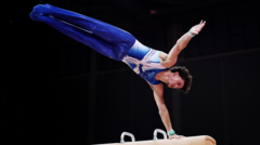 How do you score points in artistic gymnastics?